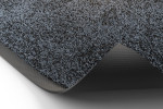 Detailbild mit gerollter Ecke von Fußmatte KLASSIK Nylonfaser 647 grau meliert - Entrada